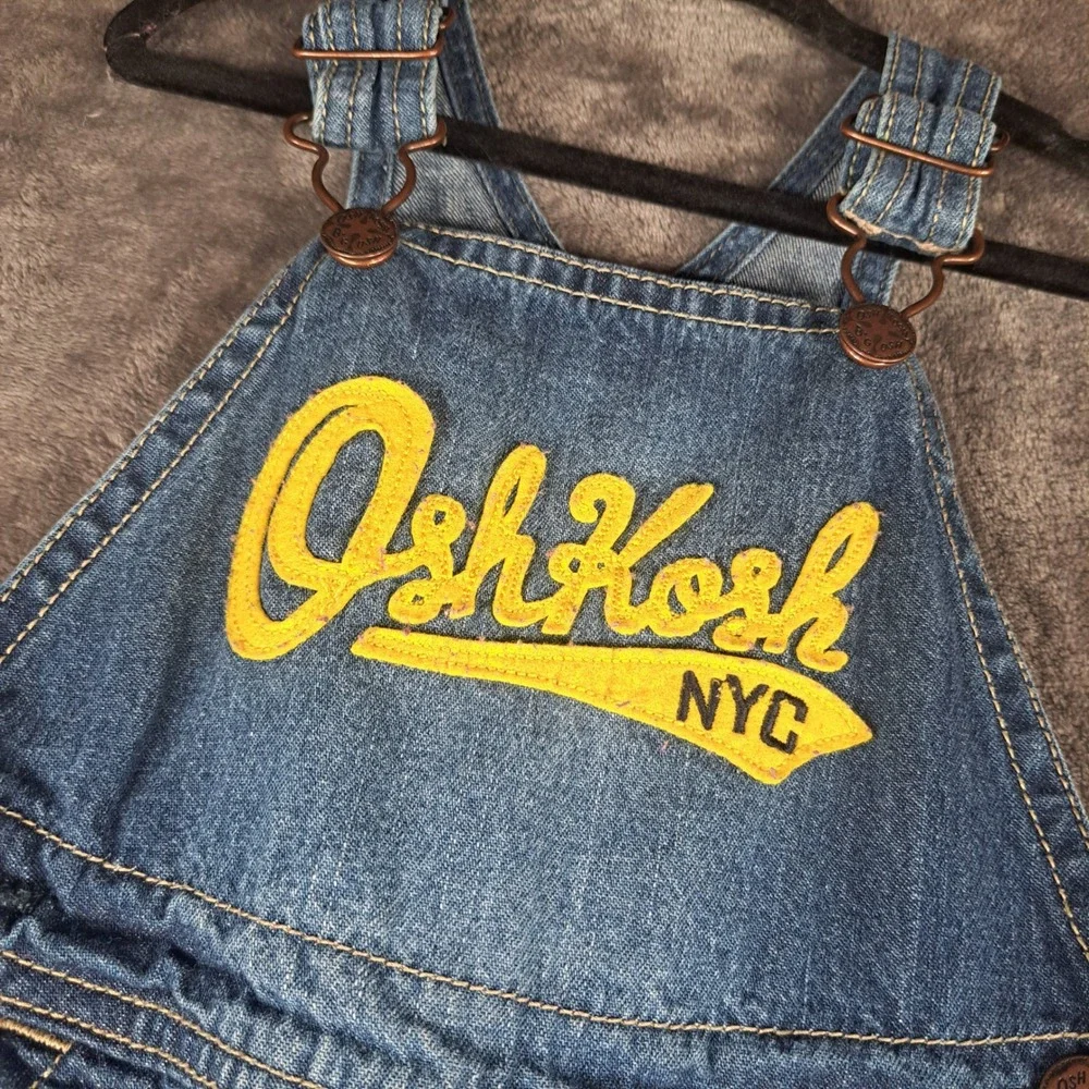 OshKosh B'gosh Blue Denim Carpenter Overalls 24 Months Yellow Logo Patch Casual‎